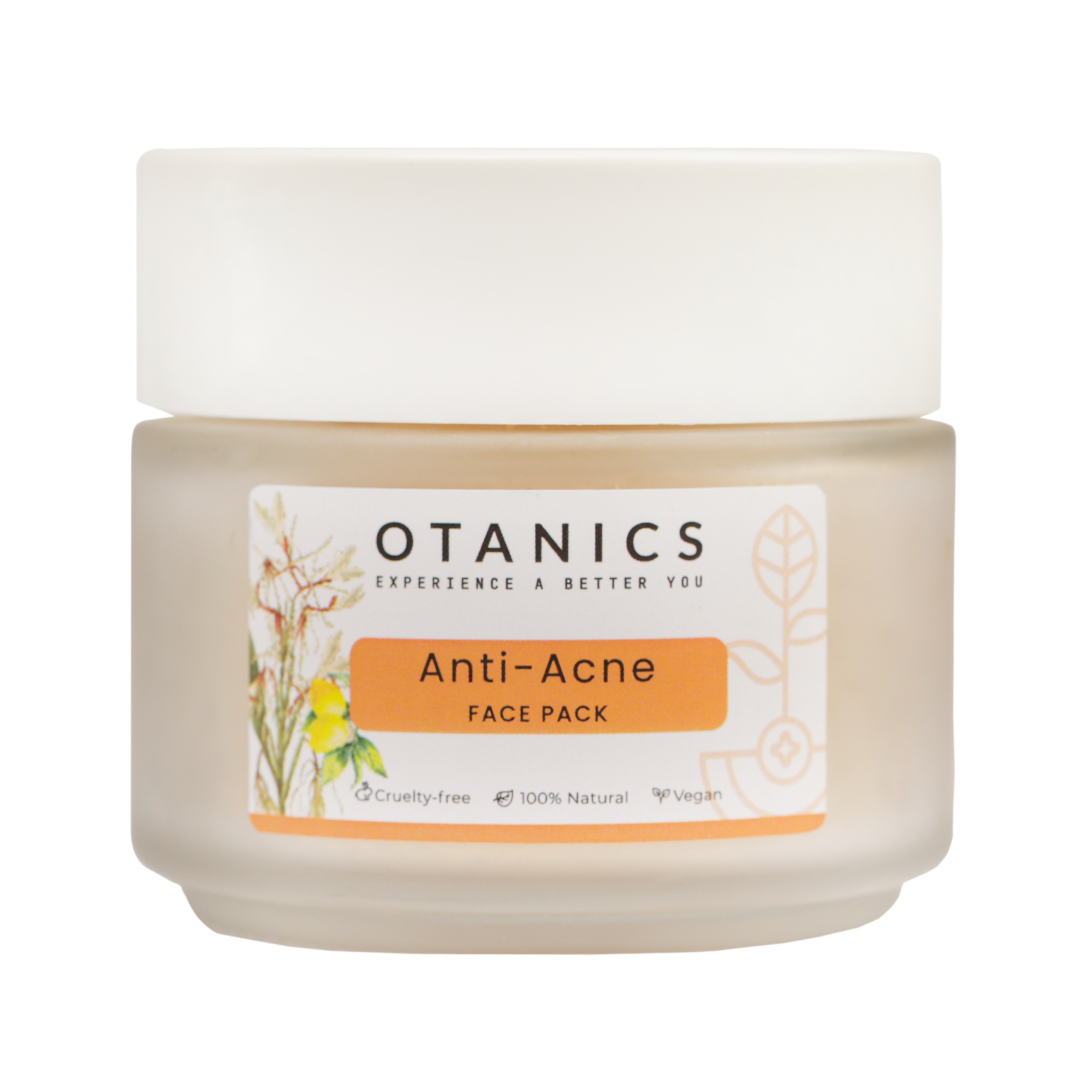 Image of the Otanics Anti-Acne Face Pack jar with a white lid and a clear label. The label reads 'Otanics Anti-Acne Face Pack' with an orange background, and includes icons indicating the product is cruelty-free, 100% natural, and vegan. The jar is placed on a white background, showcasing the product in its packaging.