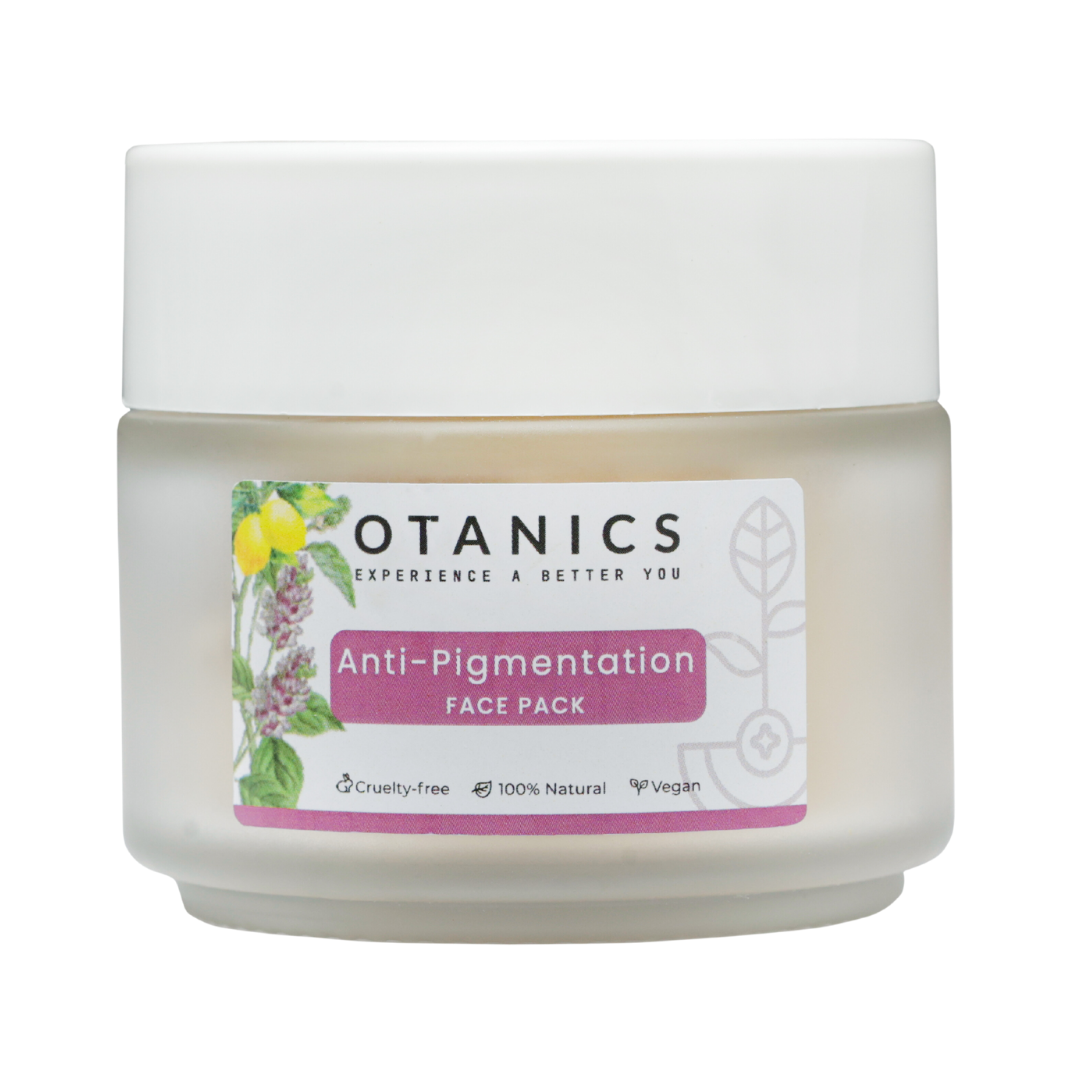 Image of Otanics Anti-Pigmentation Face Pack jar with a white lid and a clear label. The label reads 'Otanics Anti-Pigmentation Face Pack' with a purple background, and includes icons indicating the product is cruelty-free, 100% natural, and vegan. The jar is placed on a plain background, showcasing the product's packaging.